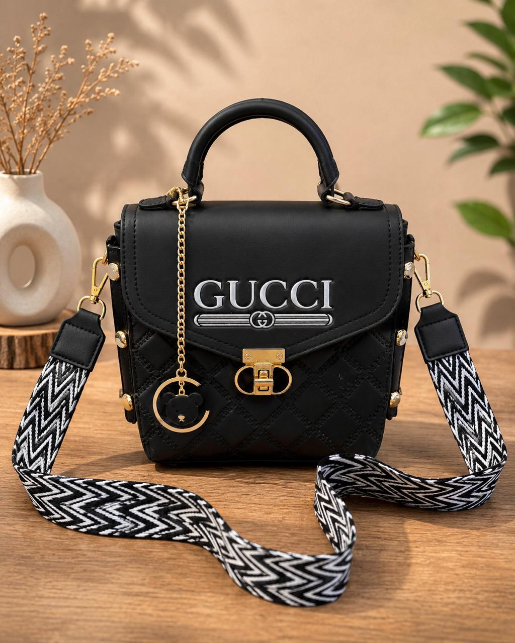 Quilted Chic Crossbody Bag with Decorative Charm & Patterned Strap